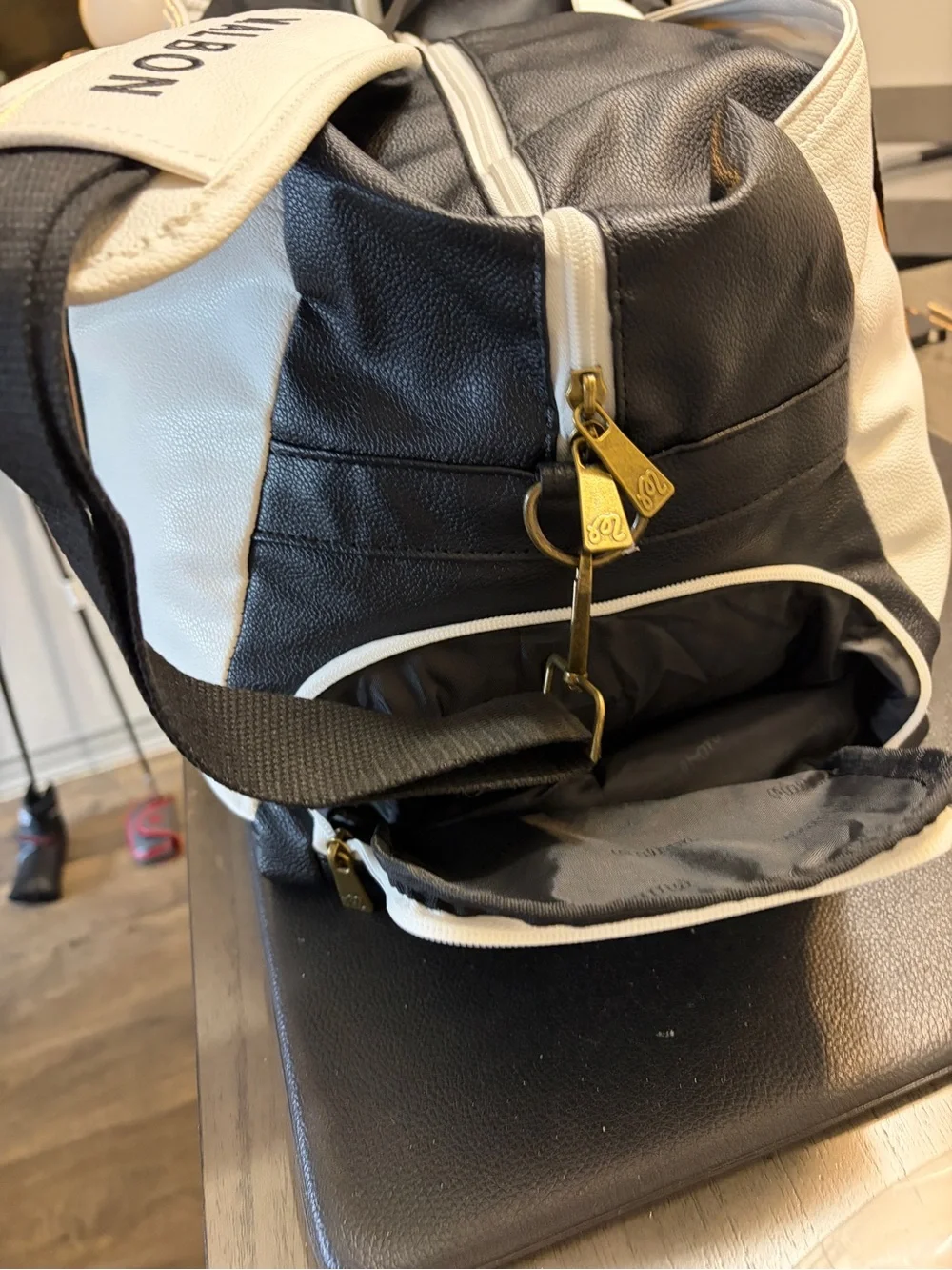 Malbon Duffel Bag Black, White, Brown.